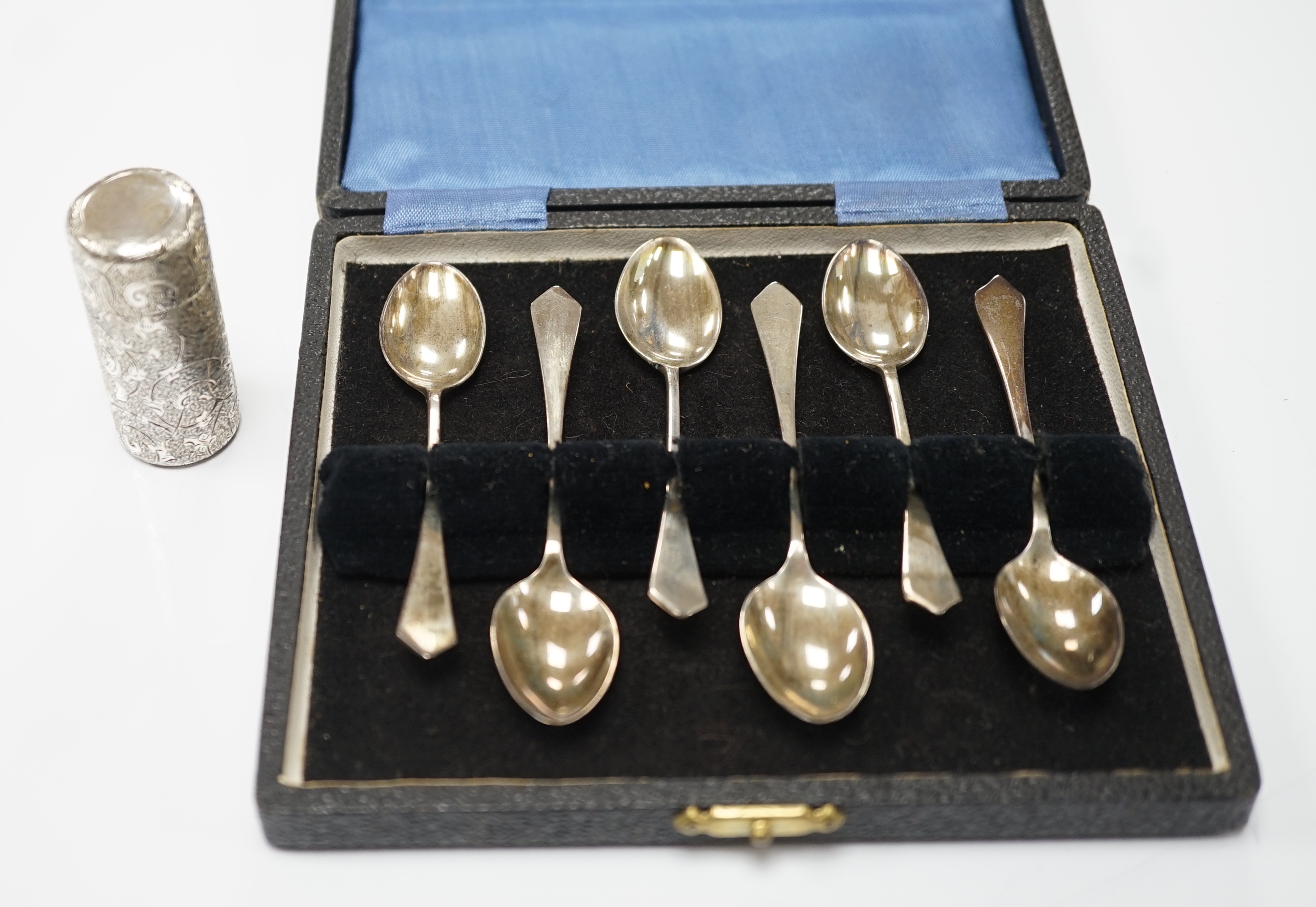 A late Victorian engraved silver cylindrical scent bottle, by Sampson Mordan & Co, London, 1882, 53mm, together with a later set of six silver coffee spoons.